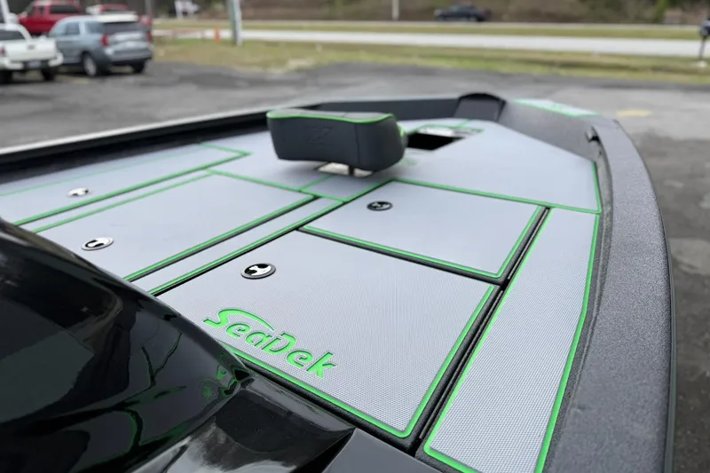 Slide: The Image of 2026 Xpress H18 boat deck with SeaDek flooring, featuring green accents. - 9