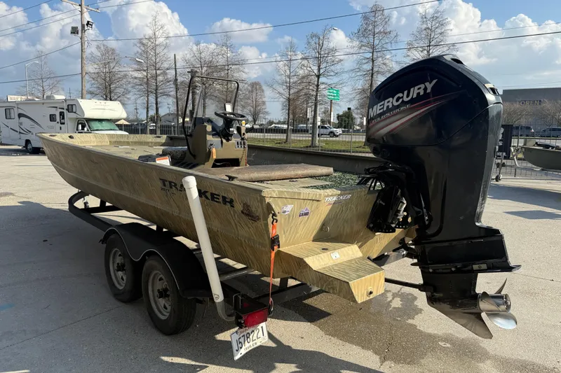 Slide: The Image of 2018 Tracker Grizzly 2072 CC boat with Mercury outboard motor on trailer. - 4