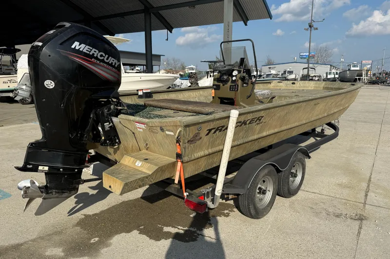 Slide: The Image of 2018 Tracker Grizzly 2072 CC boat with Mercury outboard motor on trailer. - 6