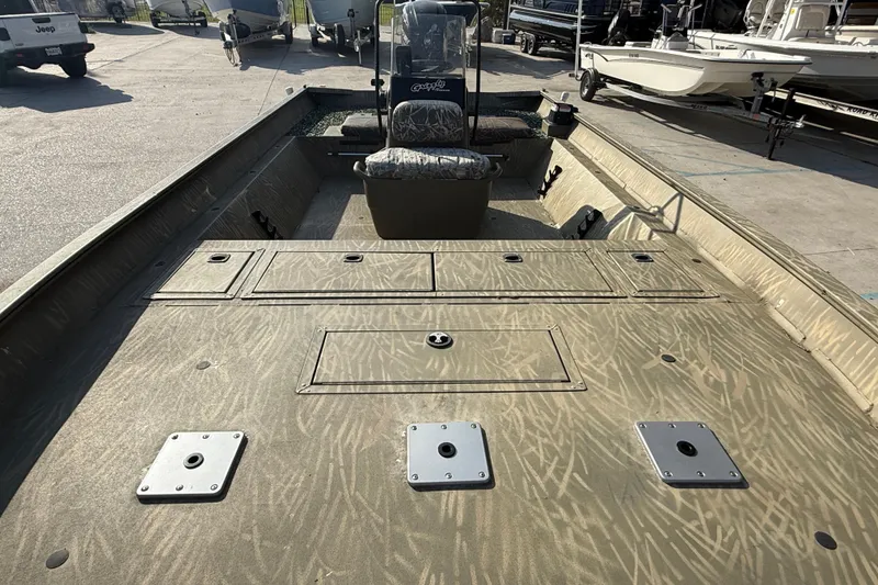 Slide: The Image of 2018 Tracker Grizzly 2072 CC boat interior with camouflage pattern and seating. - 9