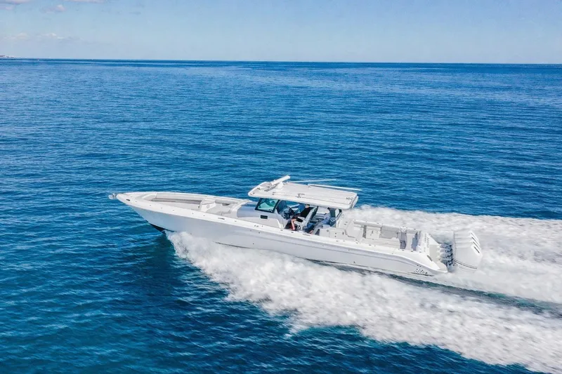 Slide: The Image of 2024 HCB 53 Suenos boat cruising on open blue ocean waters. - 1