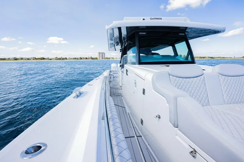 Slide: The Image of 2024 HCB 53 Suenos luxury boat on open water, featuring sleek design and comfortable seating. - 10