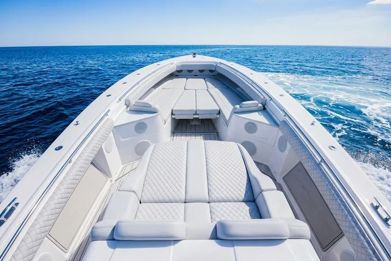 Slide: The Image of 2024 HCB 53 Suenos luxury boat with spacious seating on open ocean. - 11