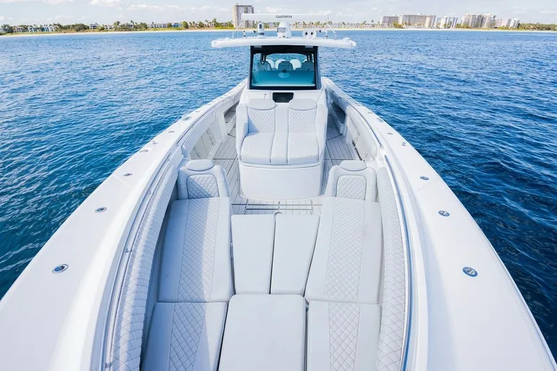 Slide: The Image of 2024 HCB 53 Suenos luxury boat with spacious seating on open water. - 12
