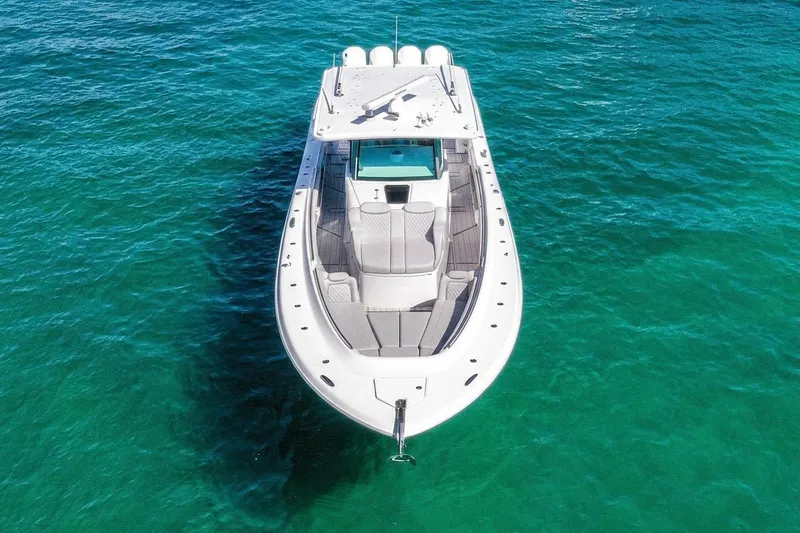 Slide: The Image of 2024 HCB 53 Suenos boat on clear turquoise water, aerial view. - 5