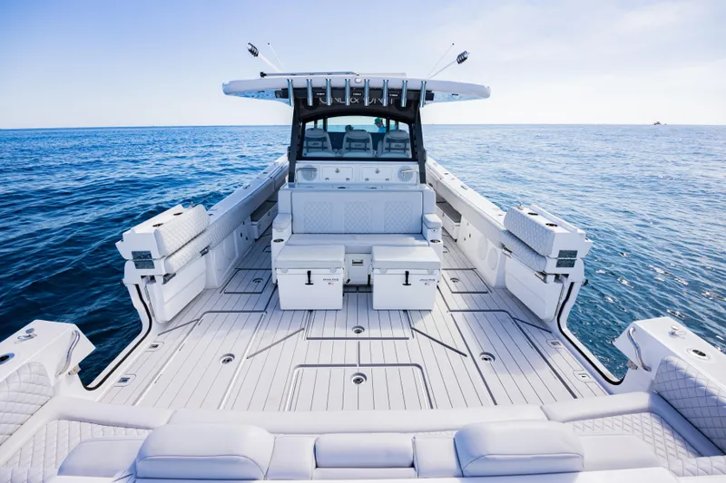 Slide: The Image of 2024 HCB 53 Suenos luxury boat deck on open sea, showcasing spacious seating and sleek design. - 7