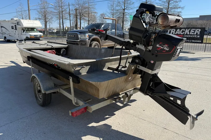 Slide: The Image of 2018 Gator Tail Gator Series 1754 boat on trailer, featuring powerful outboard motor. - 4