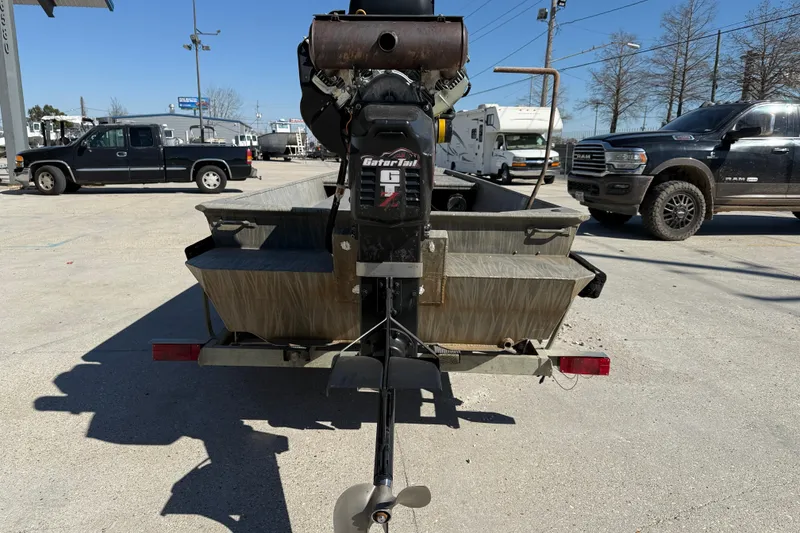 Slide: The Image of 2018 Gator Tail Gator Series 1754 boat with motor, parked outdoors. - 5