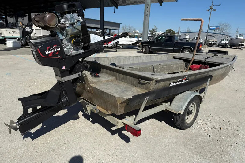Slide: The Image of 2018 Gator Tail Gator Series 1754 boat on trailer, outdoor setting. - 6