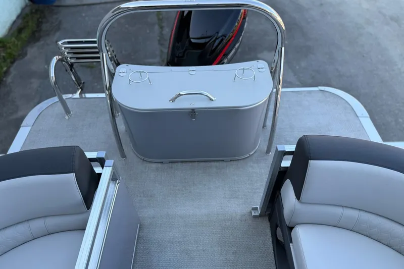 Slide: The Image of 2024 Avalon LSZ Quad Lounge boat interior with seating and storage area. - 13
