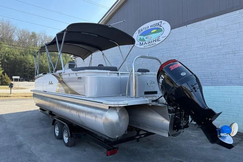 Slide: The Image of 2024 Avalon LSZ Quad Lounge 25' pontoon boat with Suzuki 250 outboard motor. - 3