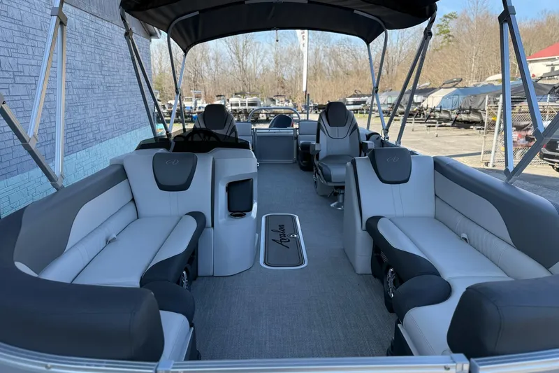 Slide: The Image of 2024 Avalon LSZ Quad Lounge 25' pontoon boat interior with luxurious seating and canopy. - 6