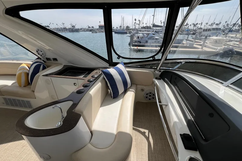 Slide: The Image of Luxurious 2013 Meridian 441 Sedan yacht interior with plush seating and marina view. - 12