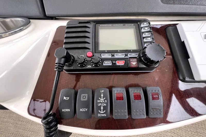 Slide: The Image of Control panel of a 2013 Meridian 441 Sedan with radio and switches. - 18