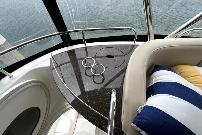 Slide: The Image of Interior of 2013 Meridian 441 Sedan yacht with striped cushions and sleek design. - 20