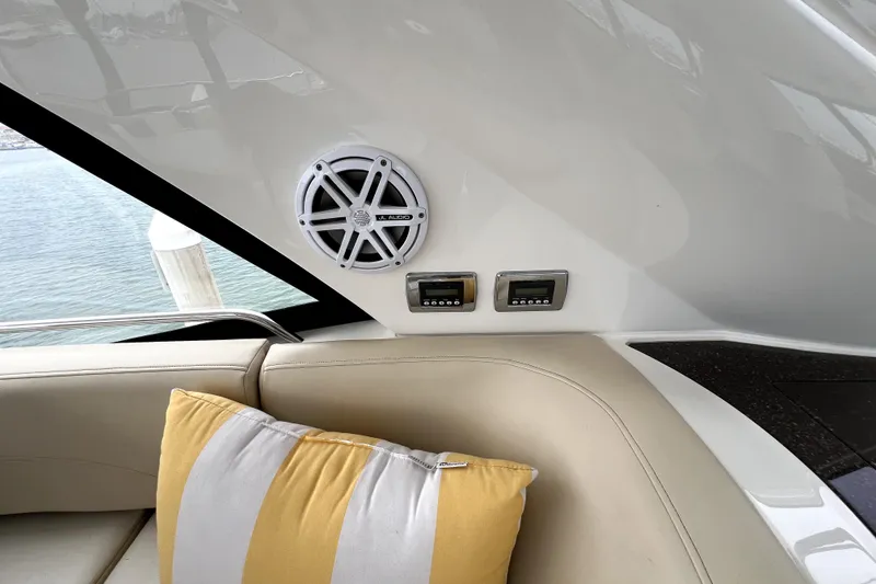 Slide: The Image of Interior of 2013 Meridian 441 Sedan with speaker, controls, and striped cushion. - 22