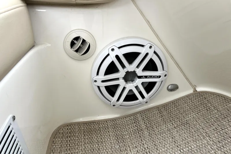 Slide: The Image of JL Audio speaker in 2013 Meridian 441 Sedan interior with beige upholstery. - 23