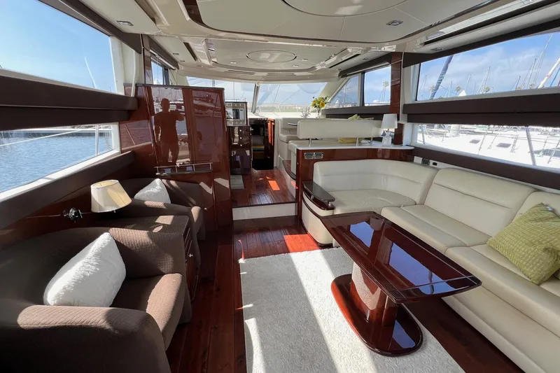 Slide: The Image of Luxurious interior of 2013 Meridian 441 Sedan yacht with elegant seating and polished wood finishes. - 26
