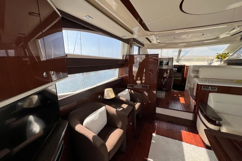 Slide: The Image of Luxurious interior of 2013 Meridian 441 Sedan yacht with elegant furnishings and panoramic windows. - 28