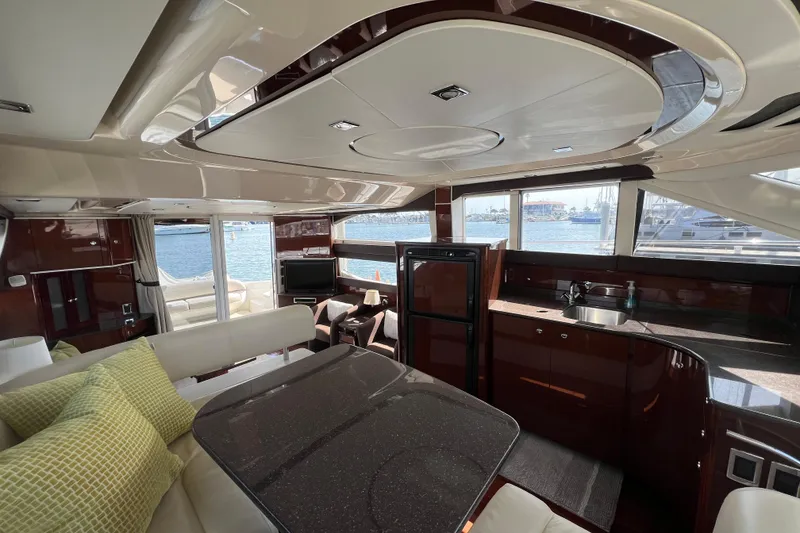 Slide: The Image of Luxurious interior of 2013 Meridian 441 Sedan yacht with modern kitchen and seating area. - 29