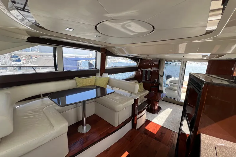Slide: The Image of Luxurious interior of 2013 Meridian 441 Sedan yacht with elegant seating and dining area. - 31