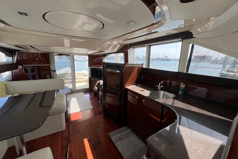 Slide: The Image of Luxurious interior of 2013 Meridian 441 Sedan yacht with modern kitchen and scenic windows. - 32