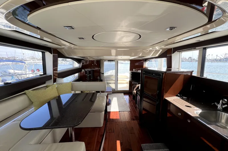Slide: The Image of Luxurious interior of 2013 Meridian 441 Sedan yacht with elegant seating and panoramic windows. - 33
