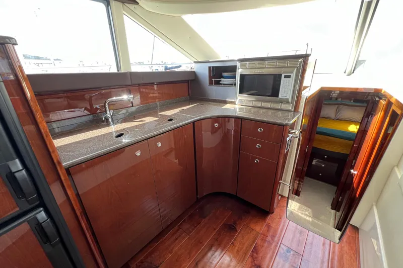 Slide: The Image of Luxurious 2013 Meridian 441 Sedan yacht kitchen with modern amenities and sleek design. - 35