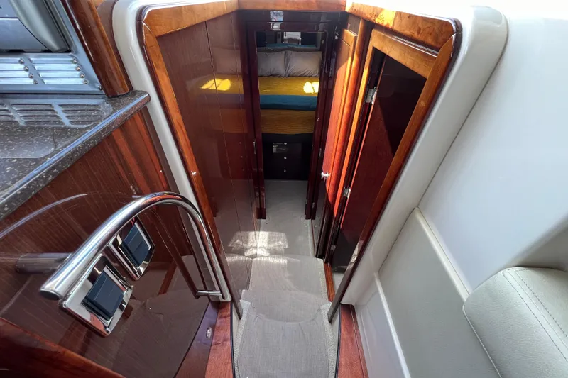 Slide: The Image of Interior view of 2013 Meridian 441 Sedan yacht with polished wood and modern design. - 36