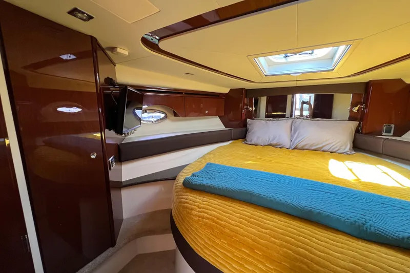 Slide: The Image of Luxurious interior of 2013 Meridian 441 Sedan yacht with cozy bed and skylight. - 38