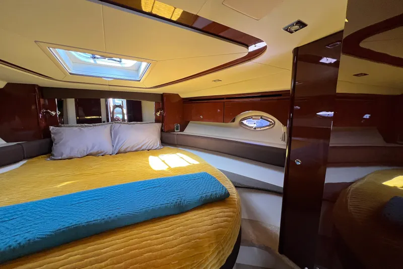 Slide: The Image of Luxurious cabin interior of 2013 Meridian 441 Sedan yacht with skylight and plush bedding. - 39