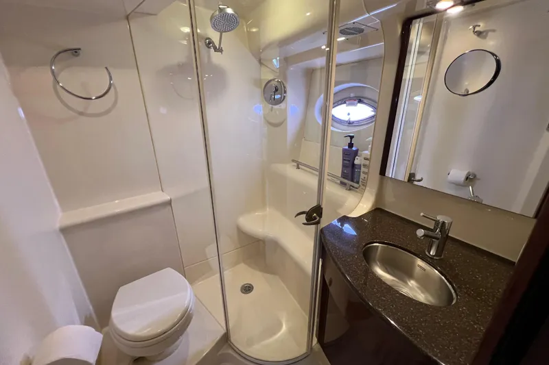 Slide: The Image of Luxurious bathroom in 2013 Meridian 441 Sedan yacht with shower, sink, and toilet. - 41