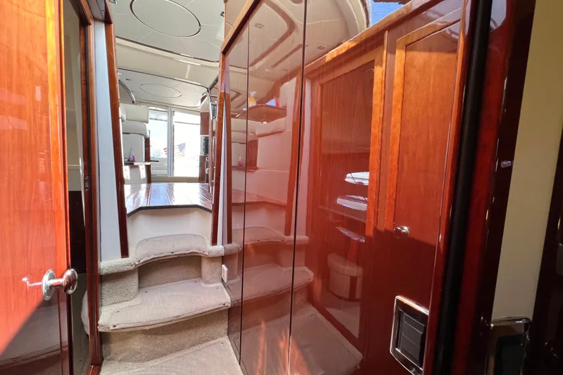 Slide: The Image of Interior view of 2013 Meridian 441 Sedan yacht with elegant wood finishes and plush carpeting. - 42