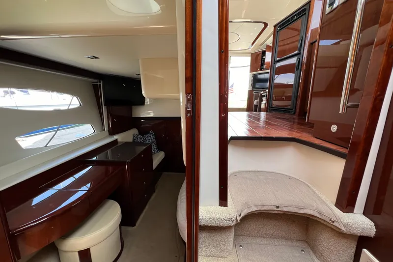 Slide: The Image of Interior of 2013 Meridian 441 Sedan yacht, featuring luxurious wood finishes and modern amenities. - 43