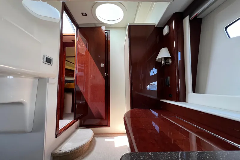 Slide: The Image of Interior of 2013 Meridian 441 Sedan yacht with polished wood and modern lighting. - 44