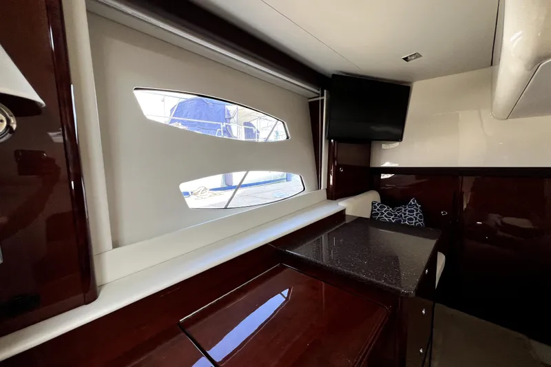 Slide: The Image of Interior of 2013 Meridian 441 Sedan yacht with window, TV, and seating area. - 45