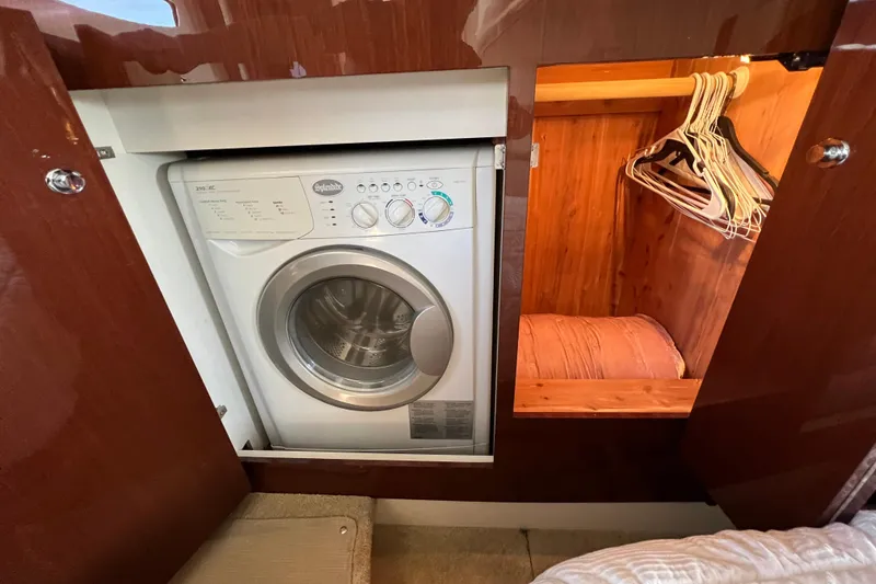 Slide: The Image of 2013 Meridian 441 Sedan interior with washer and wooden closet. - 48