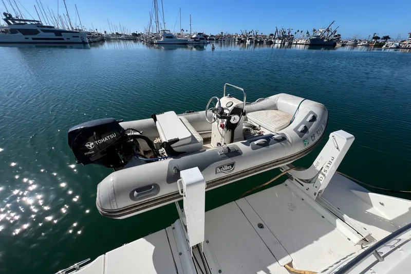 Slide: The Image of Inflatable boat with Tohatsu motor on Meridian 441 Sedan, 2013, docked in marina. - 51
