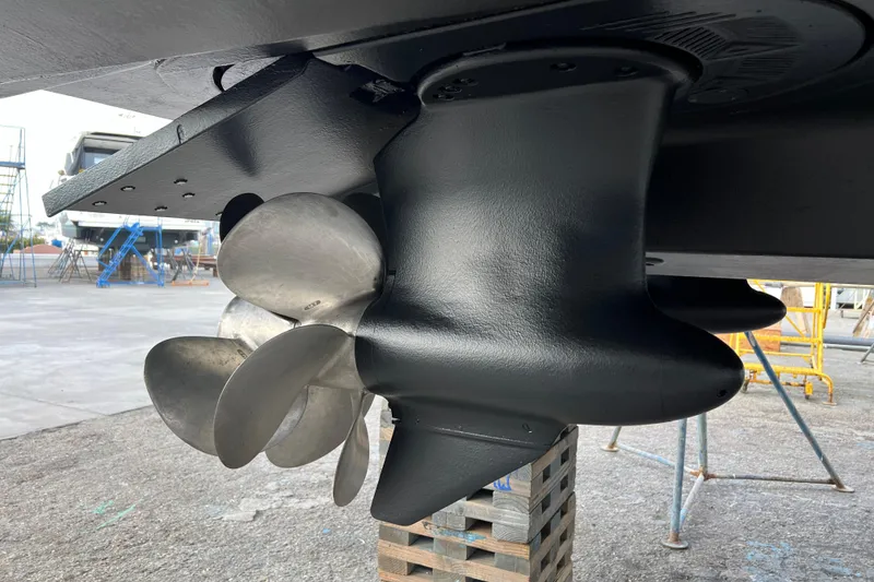 Slide: The Image of Close-up of 2013 Meridian 441 Sedan boat propeller in a shipyard setting. - 56