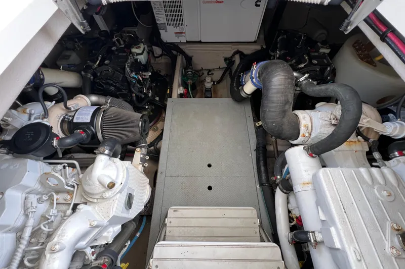 Slide: The Image of Engine room of a 2013 Meridian 441 Sedan yacht, showcasing mechanical components. - 57
