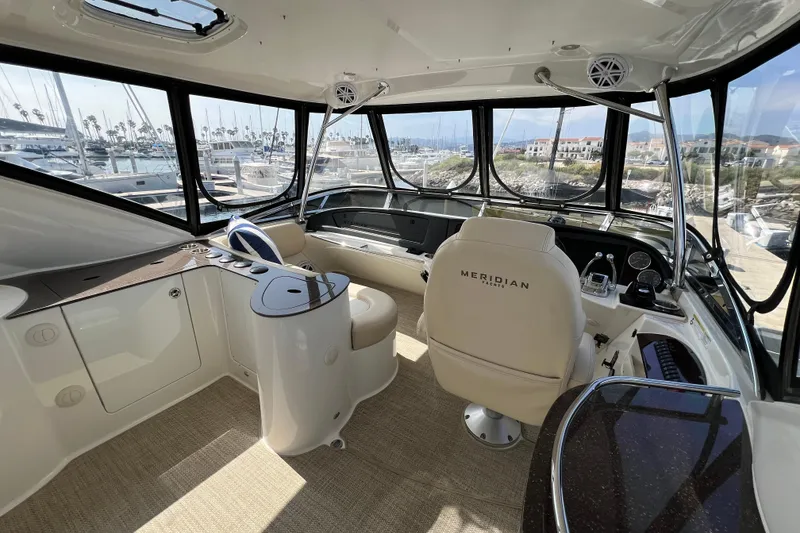 Slide: The Image of Luxurious 2013 Meridian 441 Sedan yacht interior with panoramic marina views. - 8