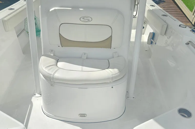 Slide: The Image of 2016 Sportsman Heritage 211 Center Console boat interior with cushioned seating. - 10