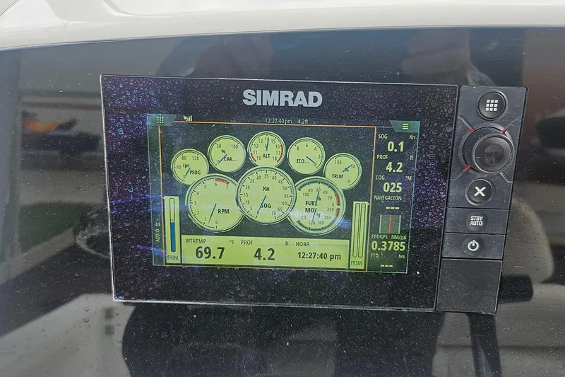 Slide: The Image of Simrad display on 2016 Sportsman Heritage 211 Center Console showing navigation and engine data. - 12