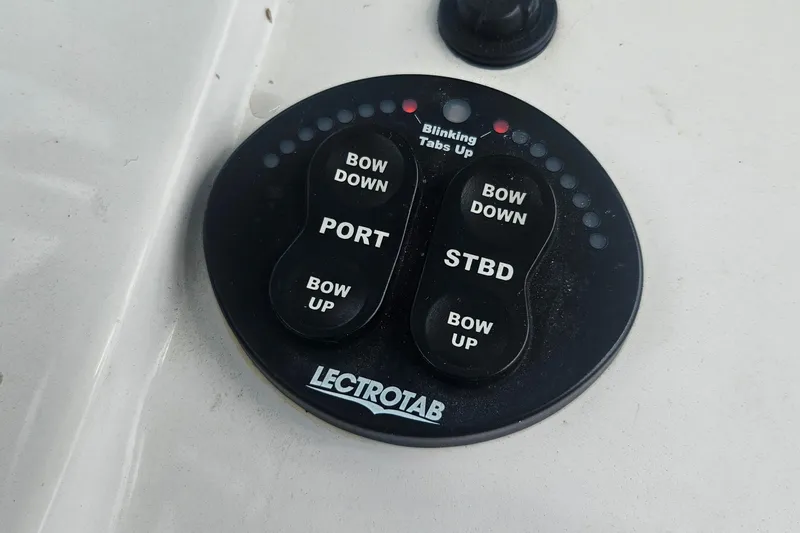 Slide: The Image of Lectrotab control panel on 2016 Sportsman Heritage 211 Center Console boat. - 13