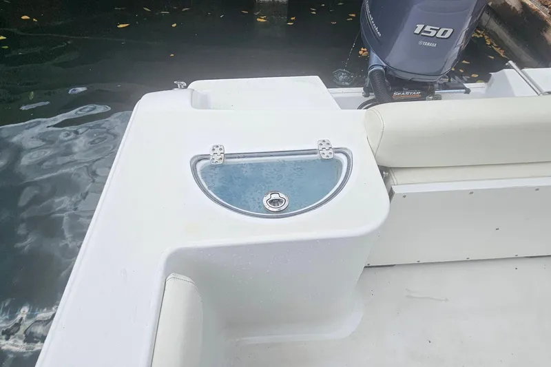 Slide: The Image of 2016 Sportsman Heritage 211 Center Console boat with Yamaha 150 engine. - 17