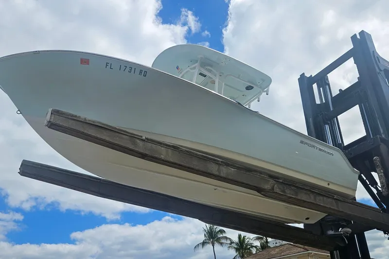Slide: The Image of 2016 Sportsman Heritage 211 Center Console boat on forklift, clear sky background. - 20