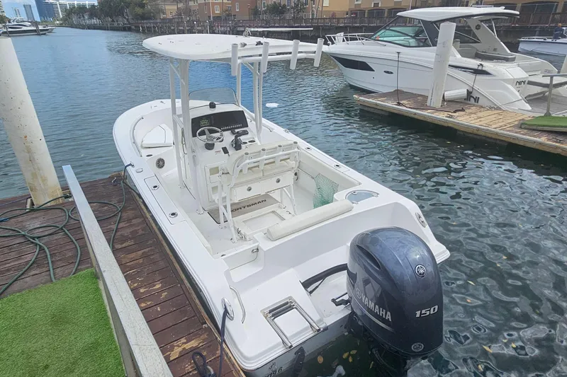 Slide: The Image of 2016 Sportsman Heritage 211 Center Console boat docked with Yamaha 150 engine. - 3