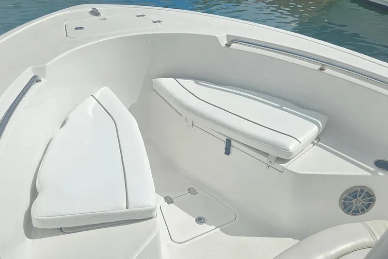 Slide: The Image of 2016 Sportsman Heritage 211 Center Console boat interior with cushioned seating. - 9