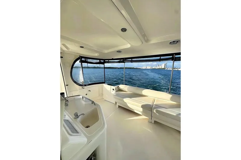 Slide: The Image of 2003 Sea Ray 390 Motor Yacht interior with ocean view and comfortable seating. - 4