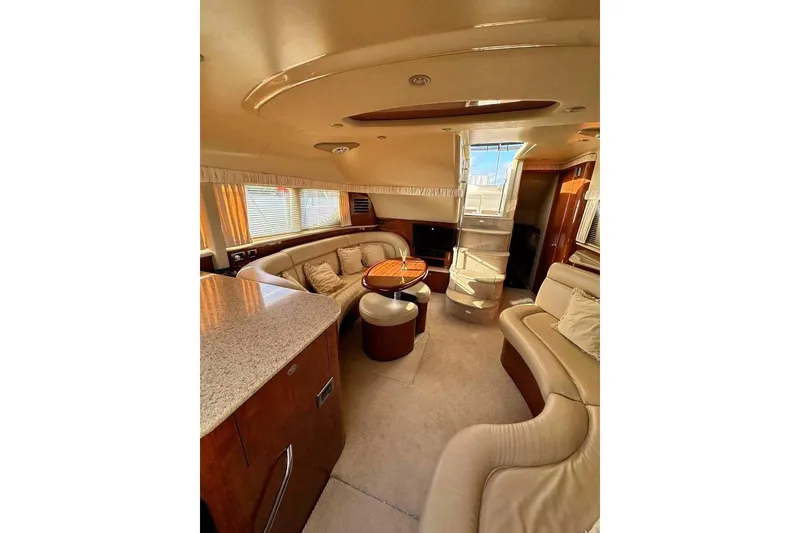 Slide: The Image of Luxurious interior of 2003 Sea Ray 390 Motor Yacht with plush seating and elegant design. - 7